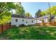 The backyard showcases a well-maintained lawn and privacy fence at 1003 E Club Blvd, Durham, NC 27704