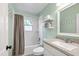 Bathroom featuring a shower and tub combination with updated vanity at 1003 E Club Blvd, Durham, NC 27704