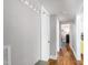 Hallway with hardwood floors leading to other rooms at 1003 E Club Blvd, Durham, NC 27704