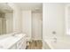 Bright bathroom featuring double vanity sinks, separate tub, and stand up shower at 1003 Walnut Dr, Erwin, NC 28339