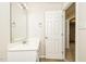 Bathroom featuring a single sink vanity, mirror and vanity lighting at 1003 Walnut Dr, Erwin, NC 28339