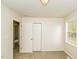 Neutral bedroom featuring plush carpeting, a closet, and a window providing natural light at 1003 Walnut Dr, Erwin, NC 28339