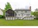 Large backyard with a screened porch, deck, and plenty of room for outdoor enjoyment at 1007 Wellstone Cir, Apex, NC 27502