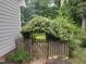 Charming backyard wooden fence and flowered archway add a touch of whimsy to the outdoor space at 1007 Wellstone Cir, Apex, NC 27502