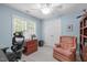 Study room with carpet flooring, a ceiling fan, natural lighting, and a comfortable chair at 1007 Wellstone Cir, Apex, NC 27502
