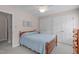 Well-lit bedroom featuring neutral walls, carpet floors, and a pair of large closets at 1007 Wellstone Cir, Apex, NC 27502