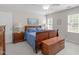 Bedroom featuring wood furniture, ceiling fan, and natural light at 1007 Wellstone Cir, Apex, NC 27502