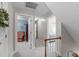 Hallway with views into adjacent rooms and carpeted floor at 1007 Wellstone Cir, Apex, NC 27502