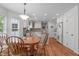 Charming eat-in kitchen featuring white cabinets, granite counters and a center island at 1007 Wellstone Cir, Apex, NC 27502