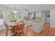 Well-lit kitchen area featuring ample cabinet space and granite countertops at 1007 Wellstone Cir, Apex, NC 27502