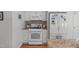 Kitchen with white appliances, gas range, and ample counter space at 1007 Wellstone Cir, Apex, NC 27502