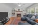 Cozy living room with built-in shelves, fireplace, and large windows for natural light at 1007 Wellstone Cir, Apex, NC 27502