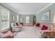 Cozy living room featuring hardwood floors, neutral paint, and bright, natural light from the windows at 1007 Wellstone Cir, Apex, NC 27502