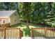 Spacious backyard featuring mature shade trees and lush grass at 103 Donna Pl, Cary, NC 27513
