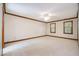 Large bedroom with neutral carpet and wood trim at 103 Donna Pl, Cary, NC 27513
