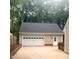 Spacious two-car garage with a white door and side entry, providing ample parking and storage at 103 Donna Pl, Cary, NC 27513