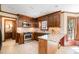 Kitchen featuring stainless appliances, granite counters, and wooden cabinets at 103 Donna Pl, Cary, NC 27513