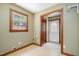 Laundry room with window, tiled floor, and access to the exterior at 103 Donna Pl, Cary, NC 27513