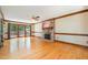 Inviting living room features a decorative brick fireplace, ceiling fan and hardwood floors at 103 Donna Pl, Cary, NC 27513
