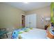 Cozy bedroom offering plush carpet, a comfortable bed, and closet access at 1033 Cuthbert Ln, Durham, NC 27703