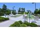 Bocce ball courts with seating, landscaping, and shade trees offer residents a recreational outdoor experience at 1033 Cuthbert Ln, Durham, NC 27703