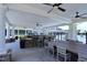 A covered bar area offers a social space with bar seating near the community pool at 1033 Cuthbert Ln, Durham, NC 27703