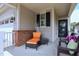 Cozy front porch with seating, offering a relaxing outdoor space at 1033 Cuthbert Ln, Durham, NC 27703