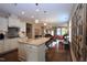 Open-concept kitchen with granite counters, stainless steel appliances, and hardwood floors at 1033 Cuthbert Ln, Durham, NC 27703