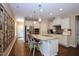 Bright kitchen with a center island, stainless steel appliances, and ample counter space at 1033 Cuthbert Ln, Durham, NC 27703