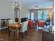 Open concept living room boasts hardwood floors and plenty of natural light at 1033 Cuthbert Ln, Durham, NC 27703