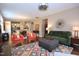 Spacious living room featuring hardwood floors, a ceiling fan, and natural light at 1033 Cuthbert Ln, Durham, NC 27703