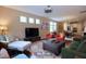 Open living area with hardwood floors, stylish furniture, and natural light at 1033 Cuthbert Ln, Durham, NC 27703