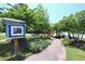 Picturesque neighborhood park featuring a lending library, bench, and beautiful landscaping at 1033 Cuthbert Ln, Durham, NC 27703