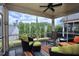 Inviting screened porch with comfortable seating and a view of the trees at 1033 Cuthbert Ln, Durham, NC 27703