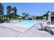Large swimming pool with lounge seating and umbrellas offers residents a cool place to relax at 1033 Cuthbert Ln, Durham, NC 27703