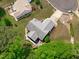 Aerial perspective of home, lush trees, and beautiful landscape create a serene outdoor experience at 108 Christy Circle Ln, Clayton, NC 27520