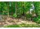 Tranquil backyard setting featuring a walking path, a creek and mature trees providing shade and privacy at 108 Christy Circle Ln, Clayton, NC 27520