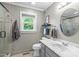 Bright bathroom features tiled floors, shower, natural light, and a vanity with ample counter space at 108 Christy Circle Ln, Clayton, NC 27520