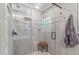 Modern bathroom featuring a glass-enclosed shower with tiled walls, a built-in niche, and seating at 108 Christy Circle Ln, Clayton, NC 27520