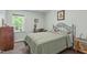 Comfortable bedroom with green walls, a full-sized bed, and a window with natural light at 108 Christy Circle Ln, Clayton, NC 27520