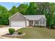 Charming home with a manicured lawn, lovely landscaping, and an attached two-car garage at 108 Christy Circle Ln, Clayton, NC 27520