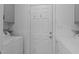 Functional laundry area with washer, dryer, utility sink, and access to the outdoors at 108 Christy Circle Ln, Clayton, NC 27520