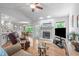 Bright and airy living room with fireplace, hardwood floors, and open-concept design at 108 Christy Circle Ln, Clayton, NC 27520