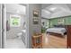Spacious main bedroom with tray ceiling, hardwood floors, and ensuite bathroom access at 108 Christy Circle Ln, Clayton, NC 27520