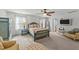 Comfortable bedroom with a ceiling fan, bedside tables, and an ensuite at 108 Yosemite Ct, Holly Springs, NC 27540