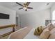 Bedroom featuring a ceiling fan, TV, and modern furniture at 108 Yosemite Ct, Holly Springs, NC 27540