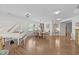 Elegant dining room featuring a white piano and a wooden table with seating for six at 108 Yosemite Ct, Holly Springs, NC 27540