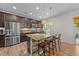 Beautiful kitchen featuring stainless steel appliances, stone counters, and a breakfast bar at 108 Yosemite Ct, Holly Springs, NC 27540