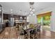 Spacious eat-in kitchen with stainless steel appliances and dark wood cabinets at 108 Yosemite Ct, Holly Springs, NC 27540