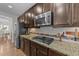 A kitchen with stainless steel appliances and granite countertops at 108 Yosemite Ct, Holly Springs, NC 27540